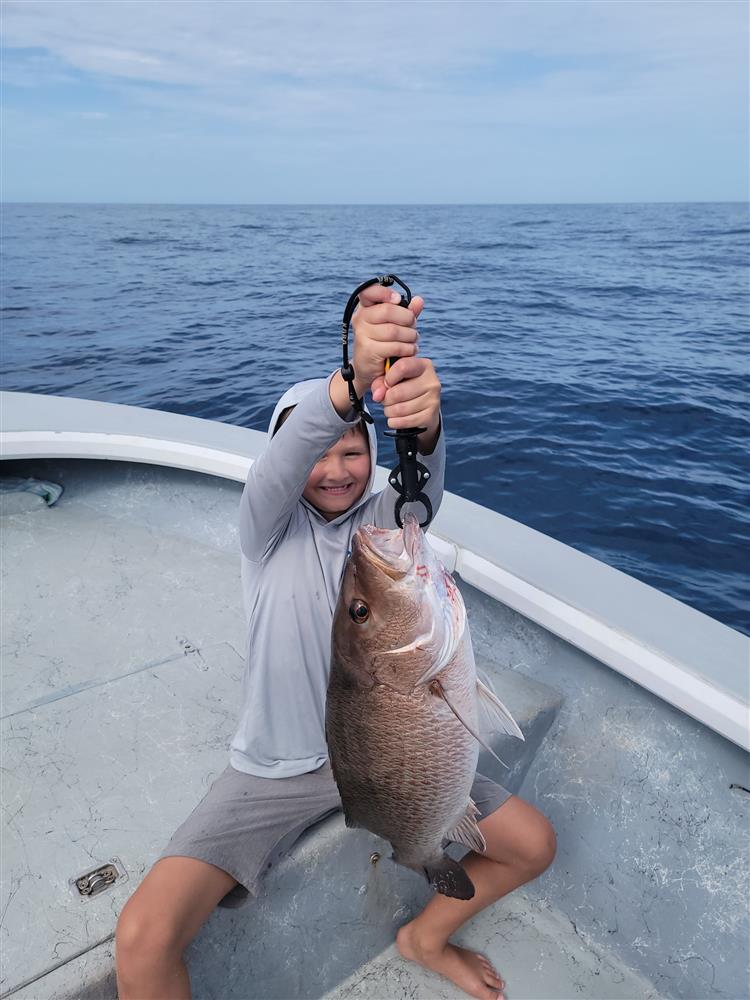Check out this young angler with a STUD of a mangrove snappa!